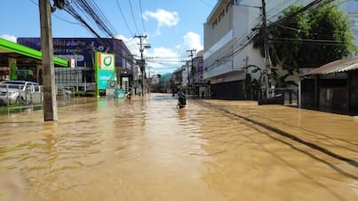 Young girl wading through waist-deep water